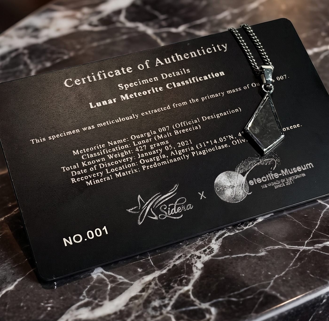 Certificate of Authenticity with the pendant resting on it